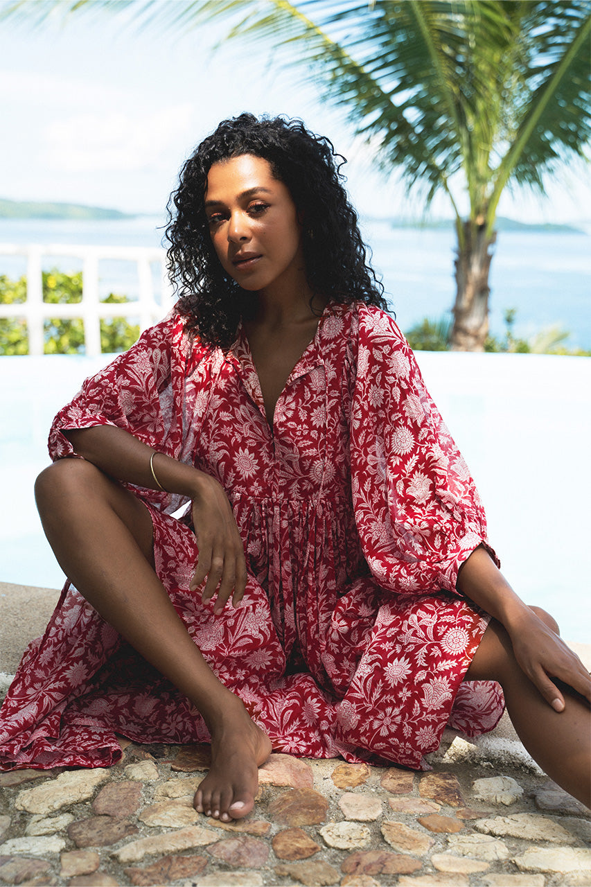 Daughters of India Kyra Midi Dress in Saffron — poolside with ocean and mountain view, cotton