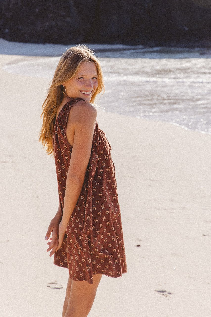 Sundress Mini Almond — outdoor lifestyle portrait, model in natural light, full length mini dress view, warm almond block print cotton sundress, Jaipur artisan made | Daughters of India